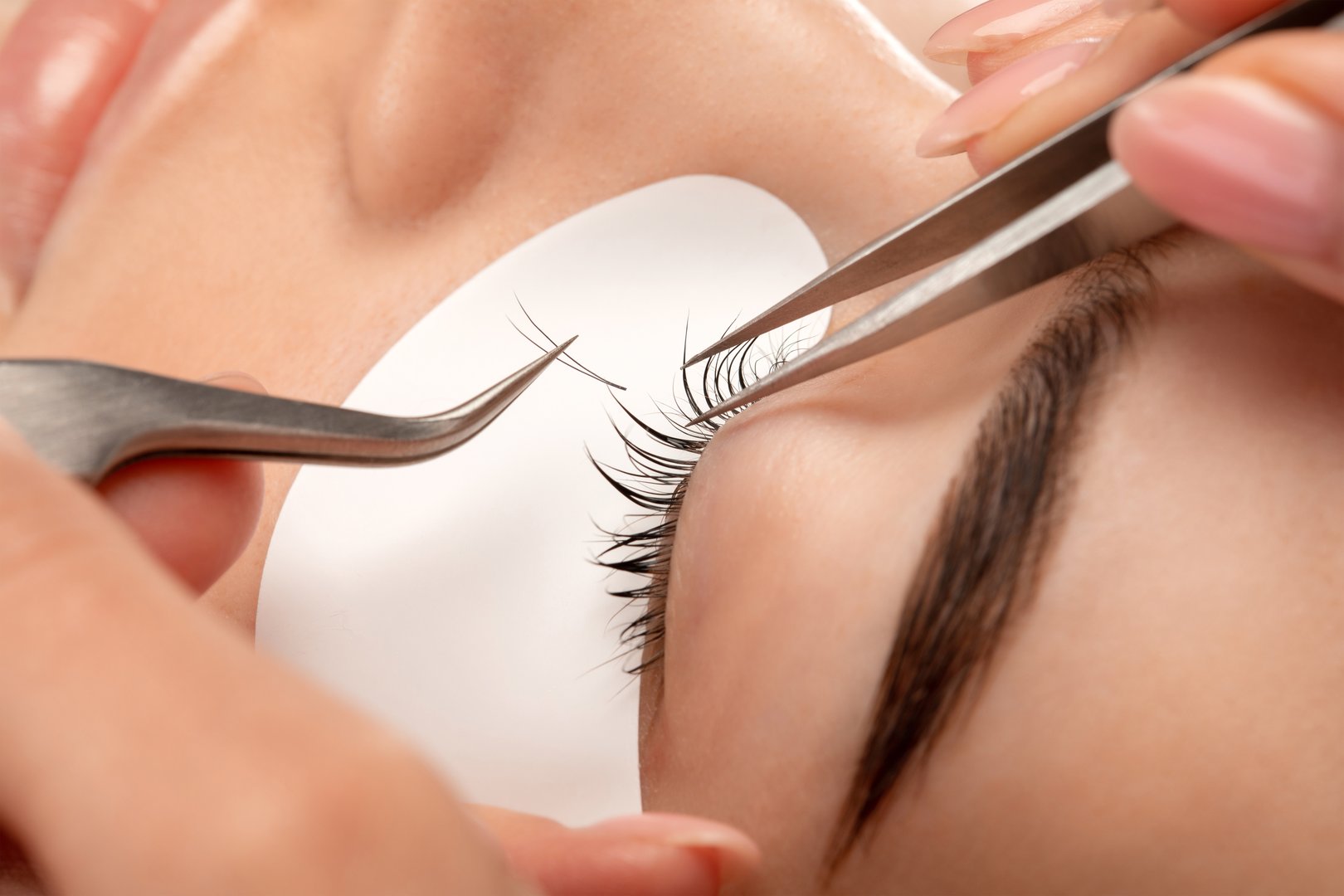 Close-up of luxury lash extensions being applied
